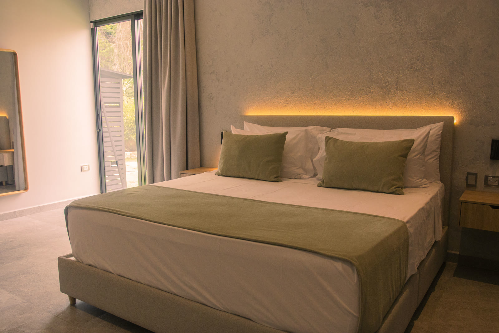 Main bedroom of the Altos de Yariguíes model home, with direct access to the terrace